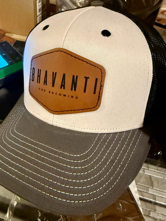 Bhavanti Heritage Trucker Cap in white and gray with signature brown leather patch